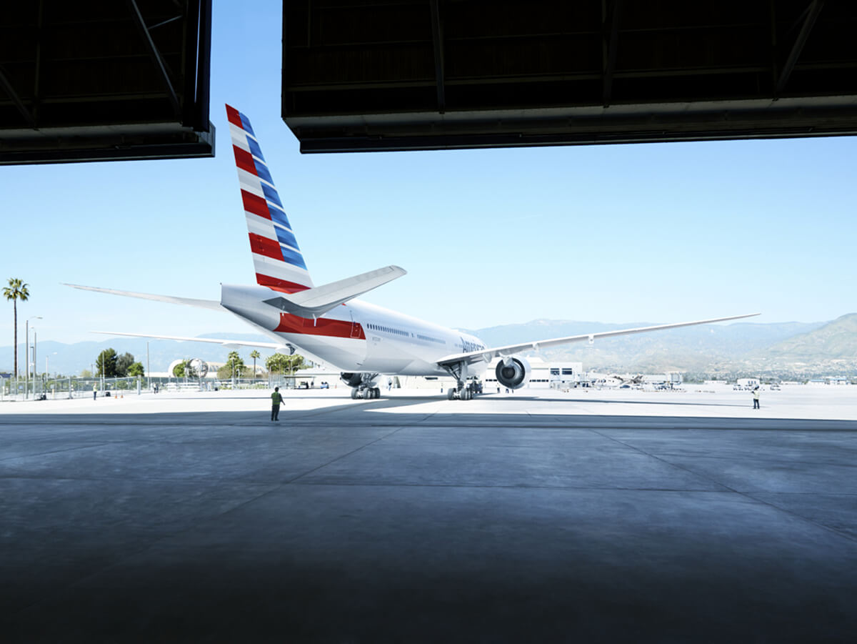 Exterior profile of American Airlines aircraft leaving hanger